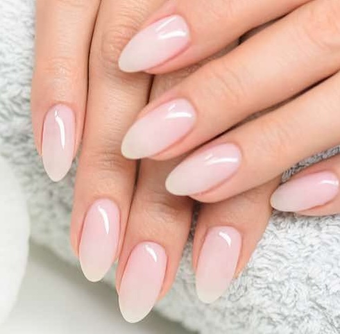 Hand showing of nails with Lush Nails Lounge and Spa nail art.